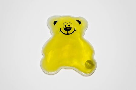 Yellow bear hot pack gel isolated on white backgroundの写真素材