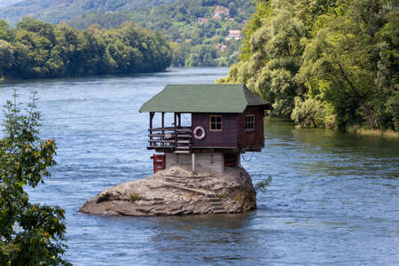 Bajina Basta, Serbia - July 14, 2020: Small house on the river Drina in Bajina Basta, Serbiaのeditorial素材