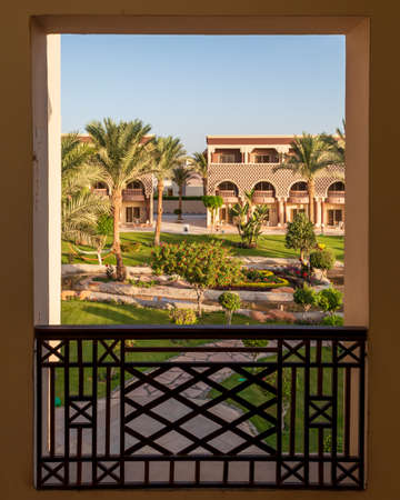 View from the balcony of the garden with palm trees and flowers in Hurghada, Egyptのeditorial素材