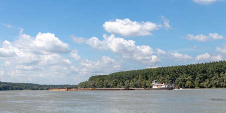 Big cargo transport by ship, at Serbian part of the river Danube