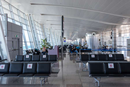 Hurghada, Egypt - October 3, 2020:View of departure area of Hurghada Airport. Due to pandemic (COVID-19), travelers wear mask. New Normal and travel under COVID-19のeditorial素材