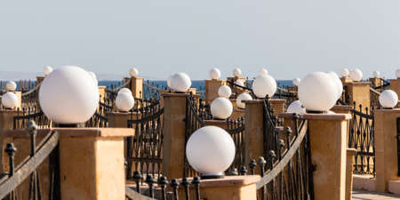 A lots of white round lamps on the dock in Egypt.の写真素材