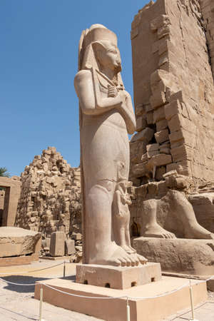 The statue of Ramses II with his daughter Merit-Amon in the temple of Amun-RA in Karnak, Luxor, Egypt.の写真素材