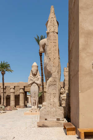 The statue of Ramses II with his daughter Merit-Amon in the temple of Amun-RA in Karnak, Luxor, Egypt.の写真素材