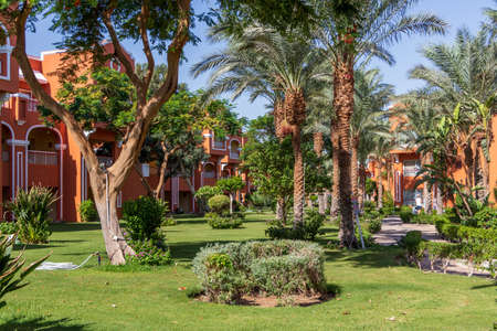 Hurghada, Egypt - September 25 2021: Egyptian garden with palm trees in hotel Caribbean World Resort Soma Bayのeditorial素材