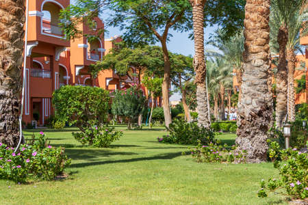Hurghada, Egypt - September 25 2021: Egyptian garden with palm trees in hotel Caribbean World Resort Soma Bayのeditorial素材
