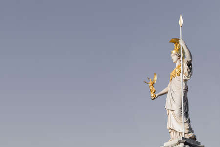 The statue of Pallas Athena on gray background with copy space for your design near Parliament building in Vienna, Austriaのeditorial素材