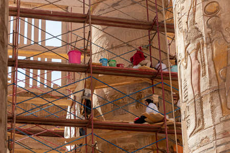 Luxor, Egypt - September 21, 2021: Cleaning of the 134 columns in the Great Hypostyle Hall at the Karnak Temple Complex.のeditorial素材
