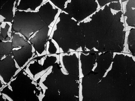Texture, cracks, stripes, with the peeling paint of old dark car, and a concept to taking a retro background, close up of the side for a car.の写真素材