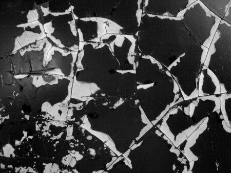 Texture, cracks, stripes, with the peeling paint of old dark car, and a concept to taking a retro background, close up of the side for a car.の写真素材