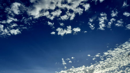 Beautiful white clouds, blue sky, the azure stratosphere, and spindrift, with texture background in nature for wallpaper pattern concept.の写真素材