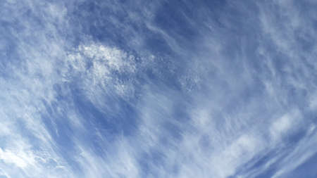 Beautiful white clouds, blue sky, the azure stratosphere, and spindrift, with texture background in...