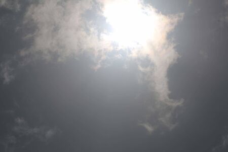 blue sky background with transparent clouds and little sunlightの写真素材