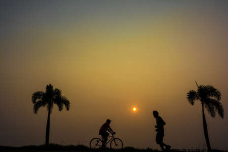 Bike and jogging in a park at Sri Racha, Thailandの写真素材
