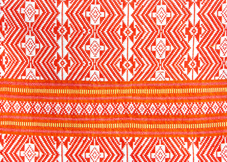 Red pattern on a garment was handmade