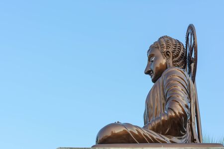 Buddha with brown color in a templeの写真素材