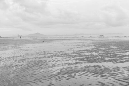 Black and white beach before rain fallの写真素材