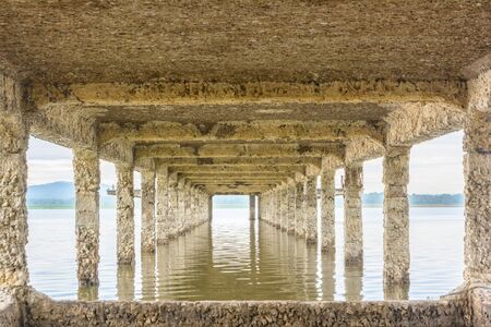 Under old bridge on pondの写真素材
