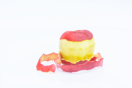 Peeled apple with white backgroundの写真素材
