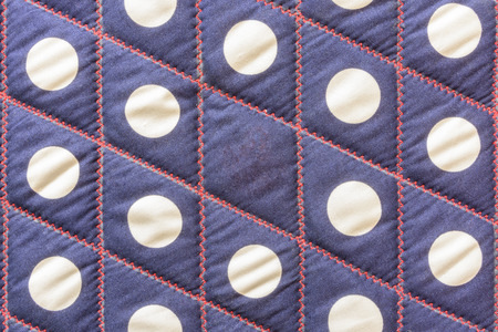Sewing pattern on blue garment backgroundの写真素材
