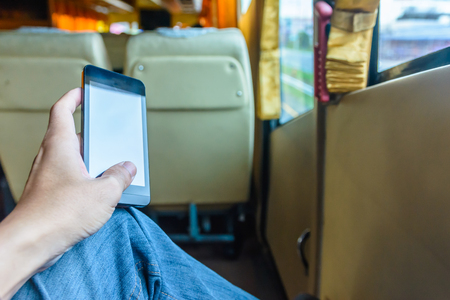 Concept and idea passenger play smartphone during travel trip on the way with bus in Thailandの写真素材