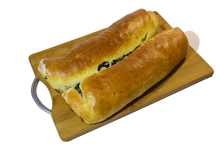 Poppy roll baked at home with on a wooden board Isolated on white background.の写真素材