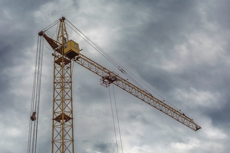 a crane in cloudy sky background photoの写真素材