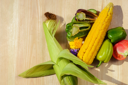 Colorful vegetables in wooden crate isolated on white backgroundの写真素材