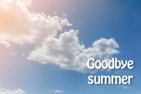 White clouds on the blue sky background. Goodbye summer. Toned.の写真素材