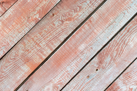 Beautiful red vintage wooden background with red hue. Texture for text.の写真素材