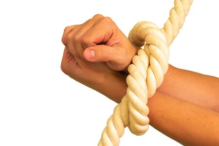 Mens hands are tied in ropes and clenched in their fists.の写真素材