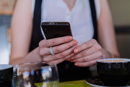 Business lady is meeting with customer in comfortable cafeの写真素材
