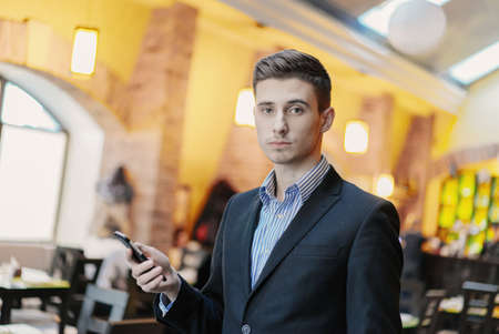 Creative young businessman in the cafe. portraitの写真素材