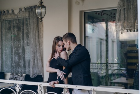 Young couple on a modern backyard overlooking the cityの写真素材
