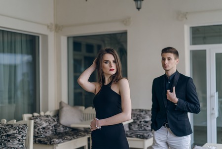 Young beautiful hipster couple vintage style posing outdoor on the street fashion style having fun togetherの写真素材