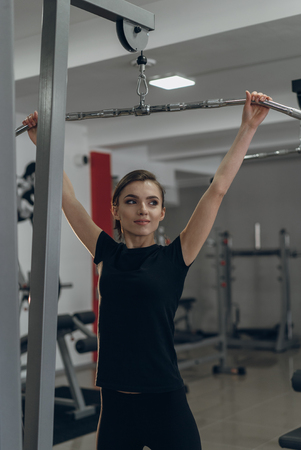 The girl at the gym on a simulator
