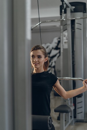 The girl at the gym on a simulator