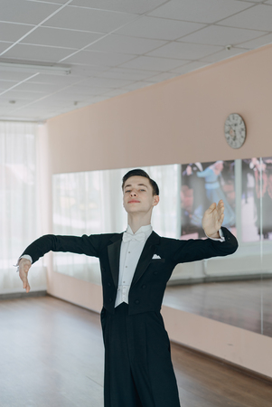 Professional dancer trained at the mirror. The young boyの写真素材