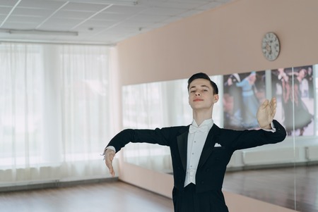Professional dancer trained at the mirror. The young boyの写真素材