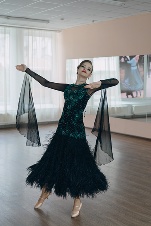 Professional dancers dancing in ballroom. Young girlの写真素材