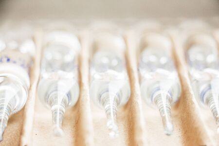 Row of transparent medical ampules in package. Close upの写真素材