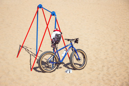 SAMARA, RUSSIA - JULY 14, 2017: Parked the bicycle on the Volga river beachのeditorial素材