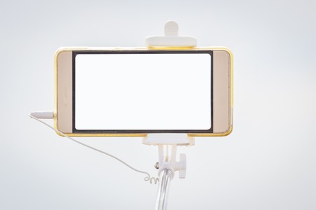Mobile Phone on tripod isolated on a light background. Copy spaceの写真素材