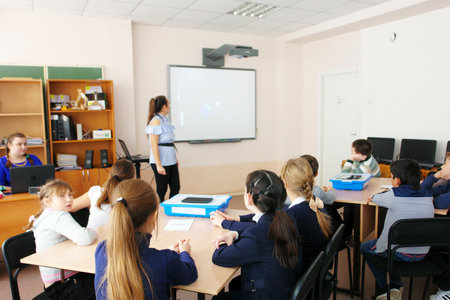 CHAPAEVSK, SAMARA REGION, RUSSIA - DECEMBER 07, 2017: School kids of elementary school in class during the lesson with teacher womanのeditorial素材