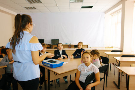 CHAPAEVSK, SAMARA REGION, RUSSIA - DECEMBER 07, 2017: School kids of elementary school in class during the lesson with teacher womanのeditorial素材