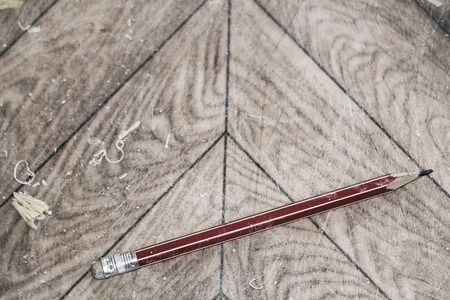 Pencil on the parquet floor. Soft focusの写真素材