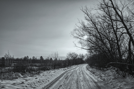 Winter landscape. Winter road covered with snowの写真素材