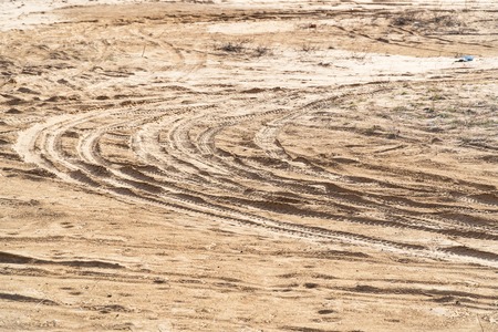 Car tracks on the sand. Selective focus
