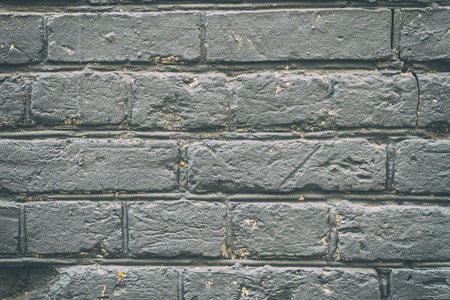Old grey brick wall for background and designの写真素材