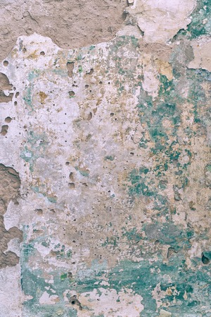 Old dirty cement wall with paint residuesの写真素材